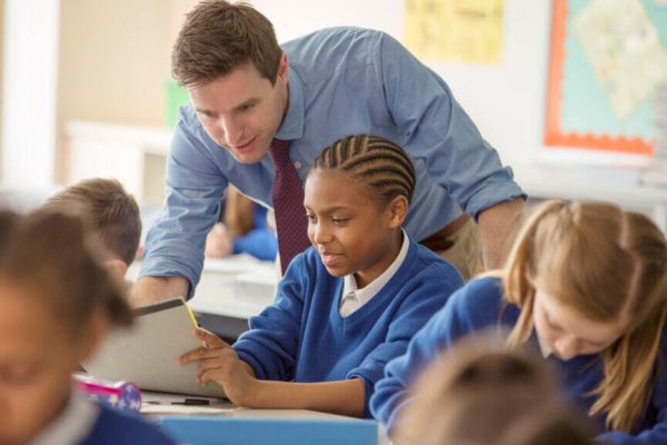 Teacher with his pupils in classroom